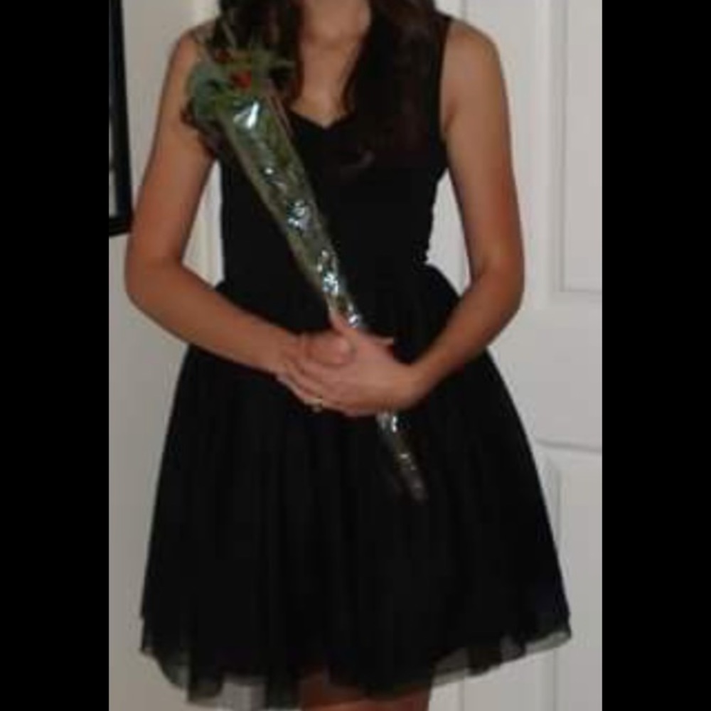 Black tank dress with tutu bottom.